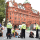 Insulate Britain activists block a road in England.